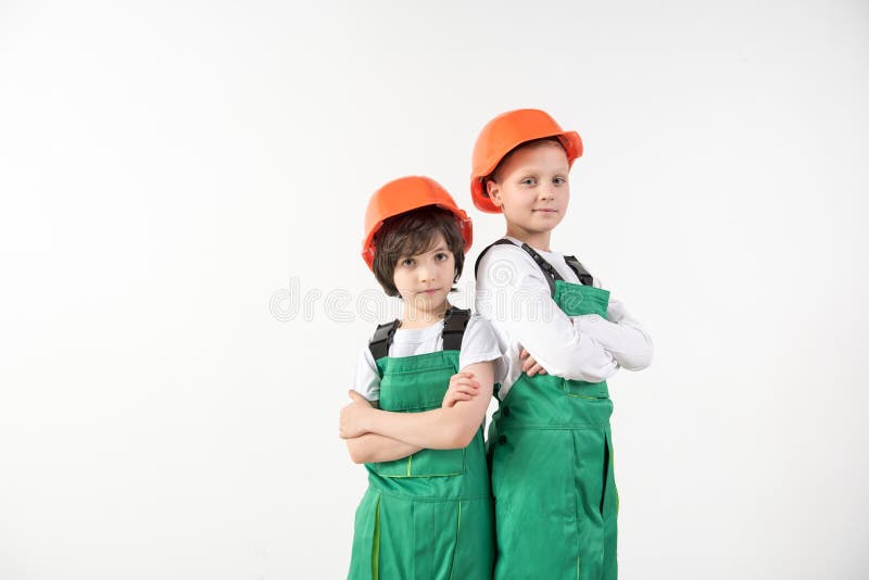 Adherent boys standing in constructor equipment royalty free stock photo Adherent boys standing in constructor equipment royalty free stock photo