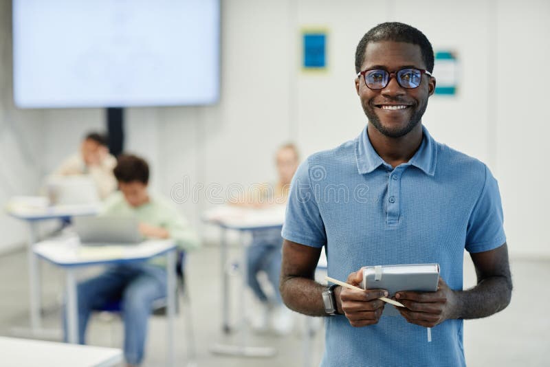 Smiling Black Teacher in School Classroom royalty free stock photos