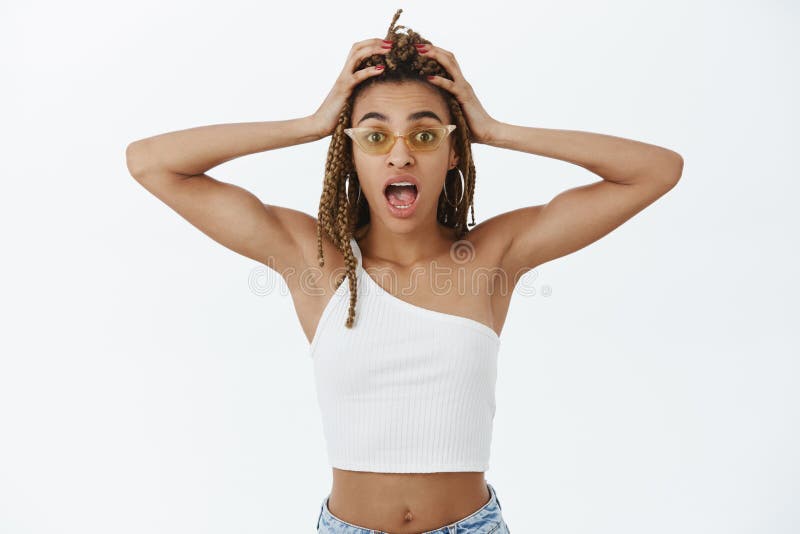 Waist-up Shot of Stylish Dark-skinned Party Girl in Trendy Sunglasses and  Top Yelling Lacking Time To Dress-up Holding Stock Image - Image of dreads,  dreadlocks: 137076453