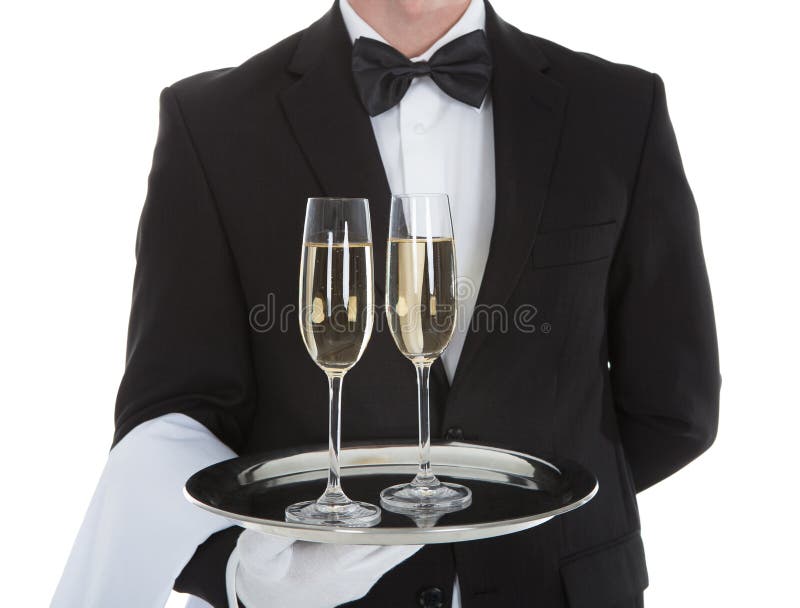 Waiter carrying champagne flutes on tray