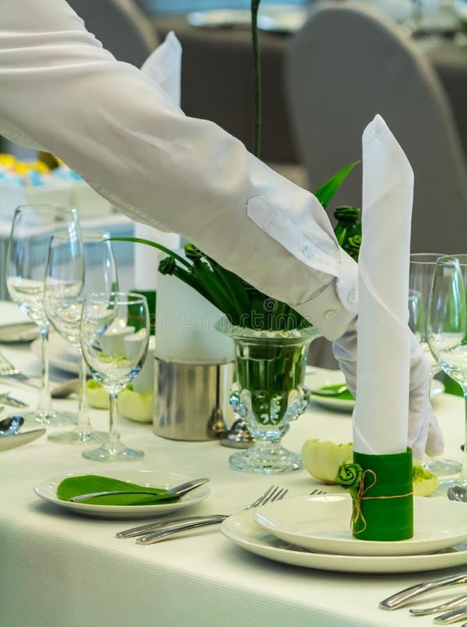 Waiter Decorate and Setting Party Dinner Table in Restaurant Stock