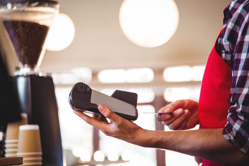 Waiter Inserting Customer S Credit Card into Credit Card Machine Stock