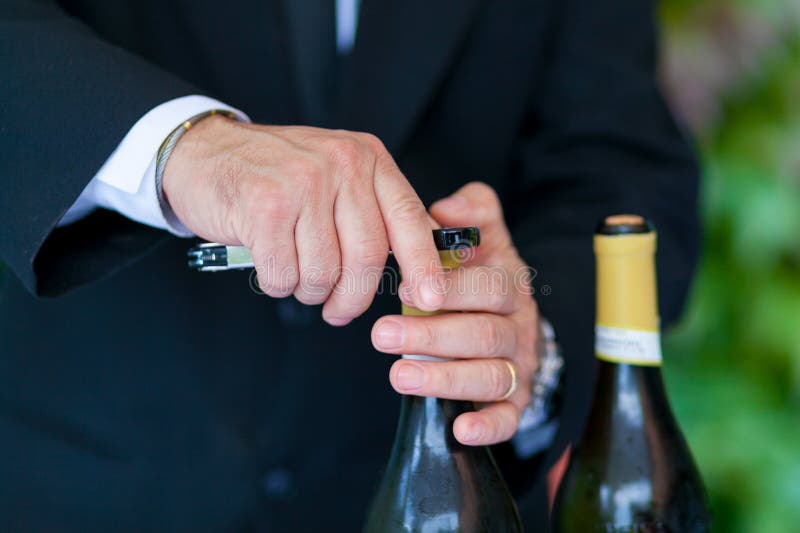 Waiter opening wine bottle stock image. Image of isolated 16692603