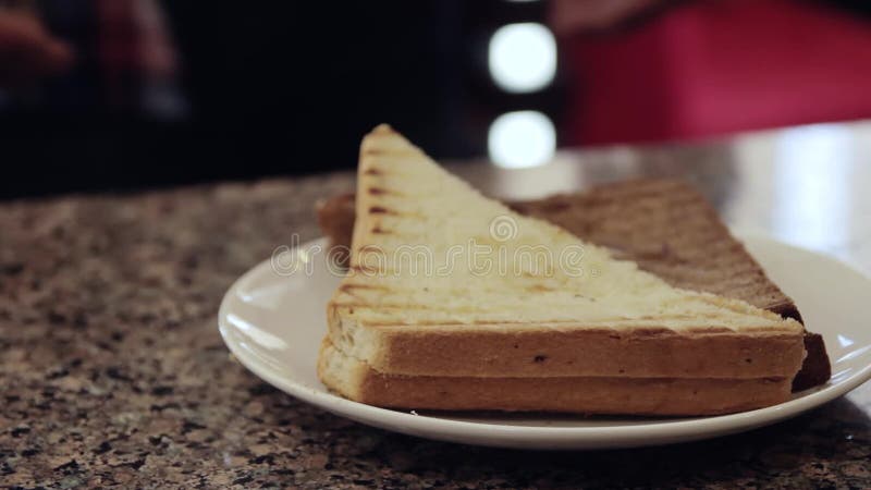 Waiter's hands give a hot sandwich. Young man hands take it. Hot cafe video