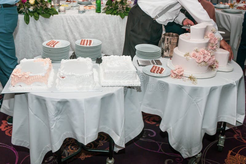 Waiter serving dessert table stock image Waiter serving dessert table stock image