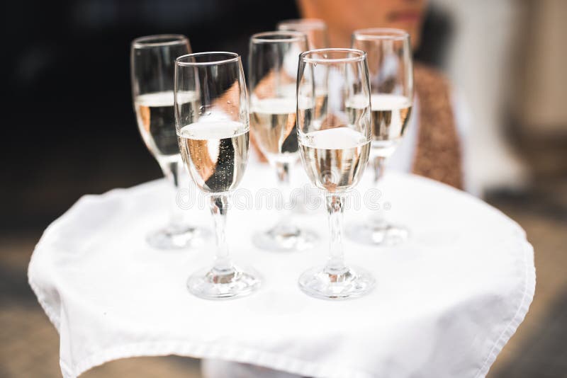Waiter Serving Glasses with Champagne on a Tray Stock Photo Image of