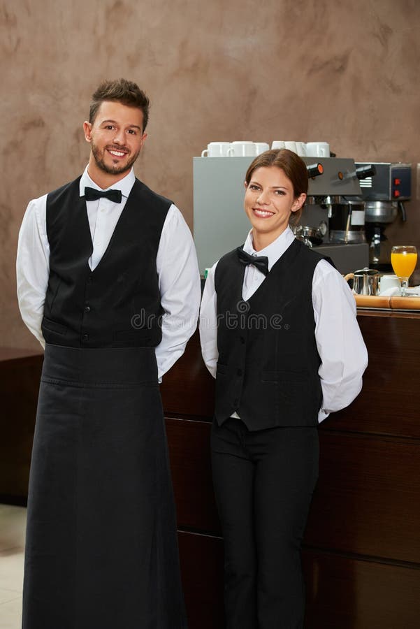Waiter and waitress in uniform stock photo Waiter and waitress in uniform stock photo