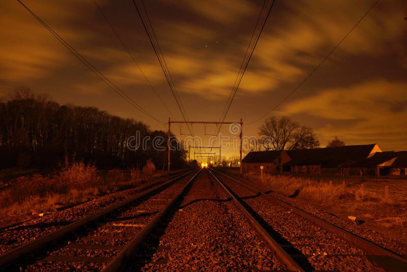 Railroad in Flanders during night. Night train stock images, royalty-free photos and pictures