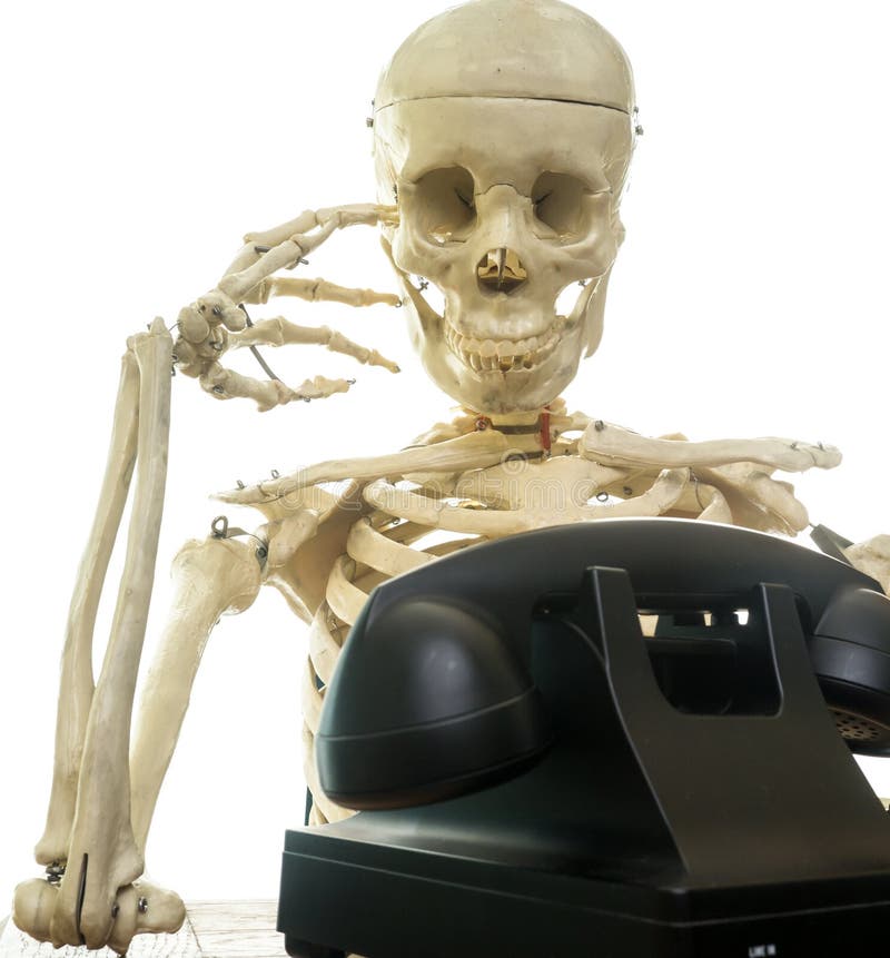 A human turns into a skeleton waiting for someone to call on the telephone.