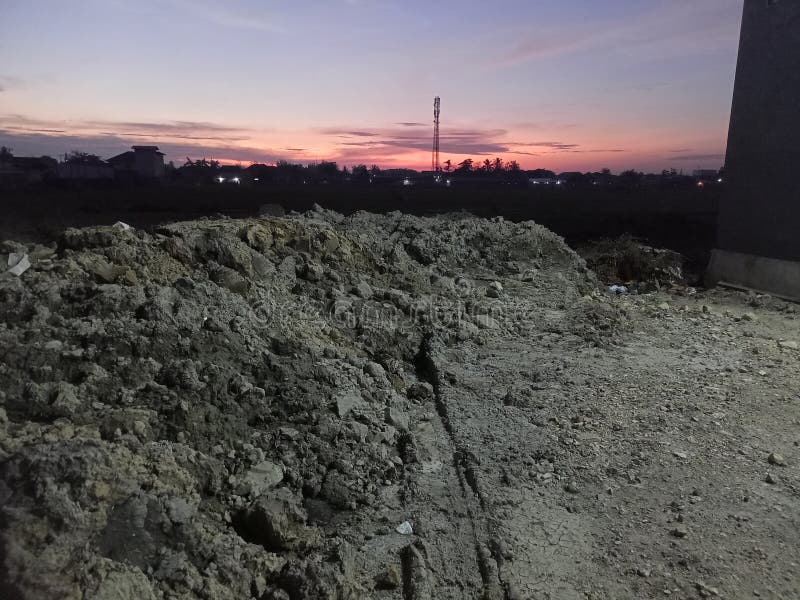 Waiting for the sun to rise above the mound of former rice fields stock photos