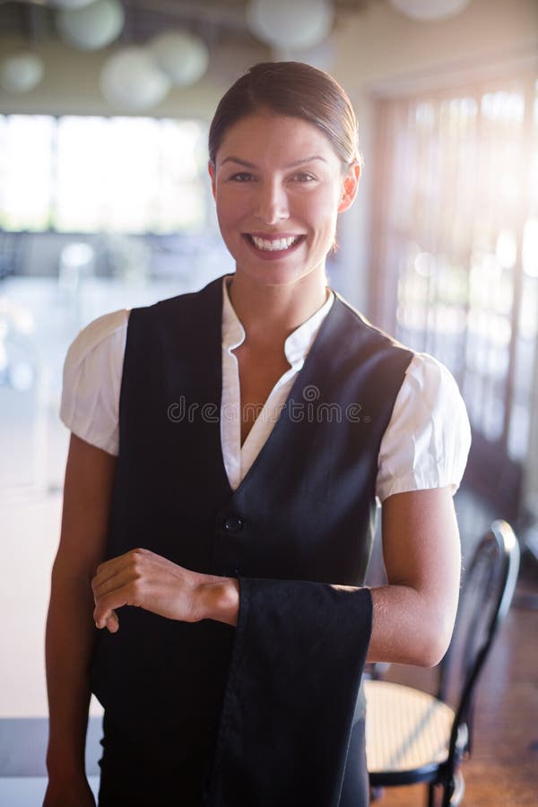 Waitress with Napkin Draped Over Her Hand Stock Photo Image of happy