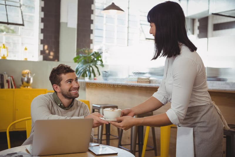 Waitress Serving Coffee To Man in Cafe Stock Photo Image of cafe