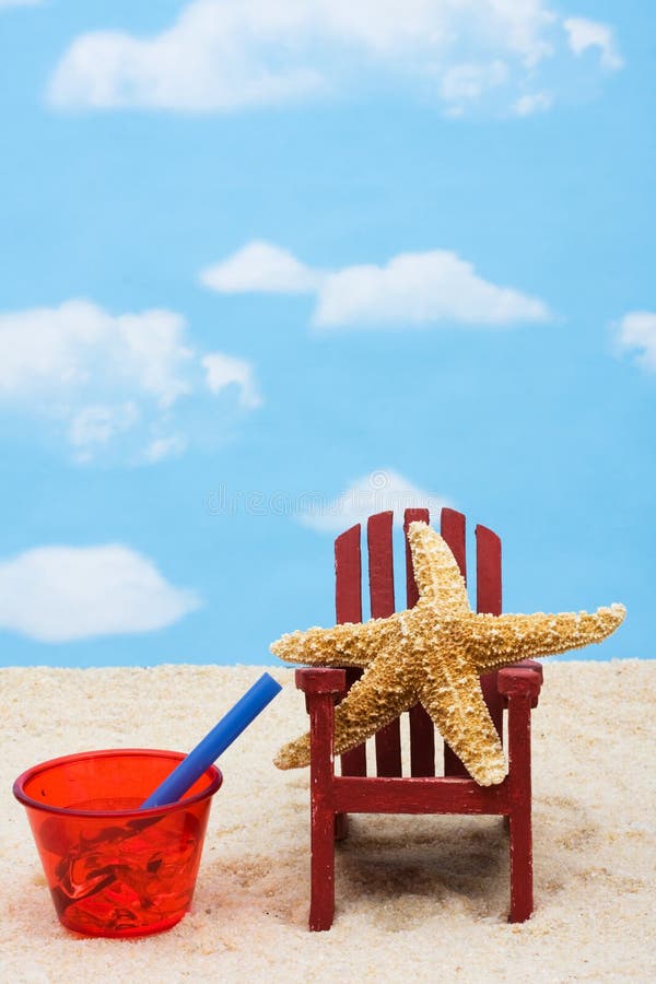 Starfish in an Adirondack chair sitting in the sand on the beach, summer vacation. Starfish in an Adirondack chair sitting in the sand on the beach, summer vacation