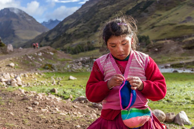 Wakawasi, Peru - Young Peruvian Girl Knitting and Selling Her Handmade Artifacts, along the Inca Trail stock images Wakawasi, Peru - Young Peruvian Girl Knitting and Selling Her Handmade Artifacts, along the Inca Trail stock images