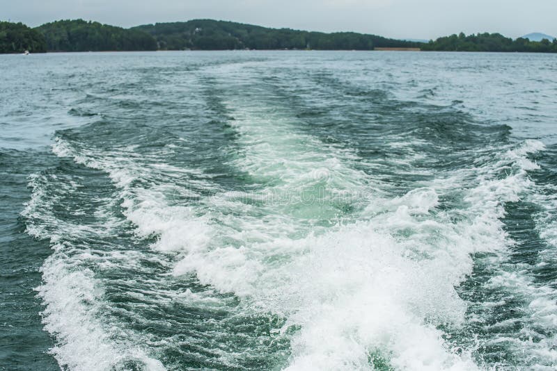 Wake from a boat on lake stock image. Image of keowee 57431245
