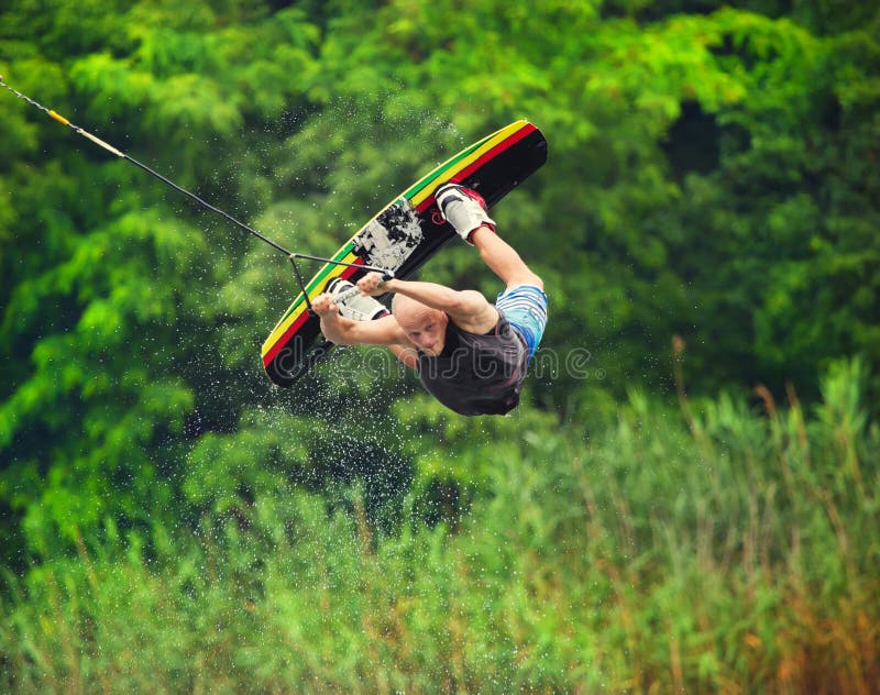 Wakeboarder making trick stock photo. Image of wakeboard 61311594