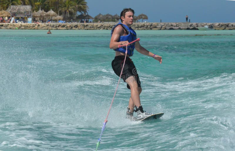 Wakeboarder Riding with only One Hand in Aruba Stock Photo Image of