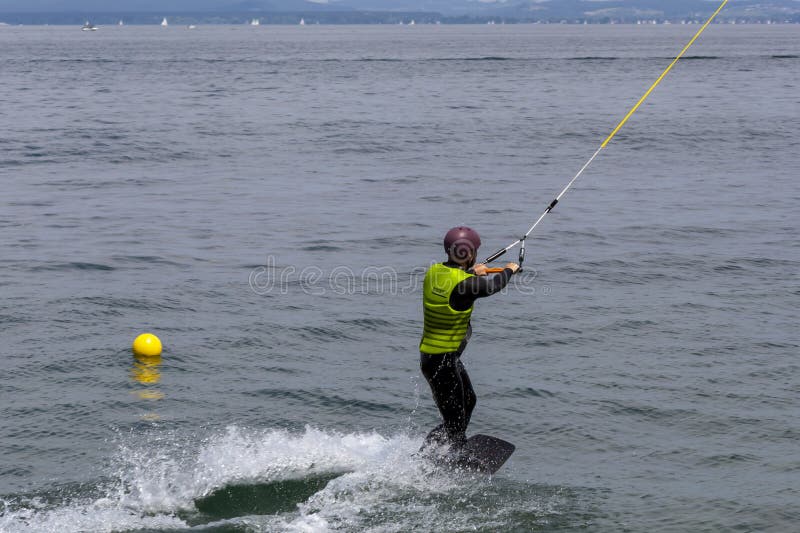 Wakeboarding with a Guide Mechanism. an Unknown Man Holds on To the