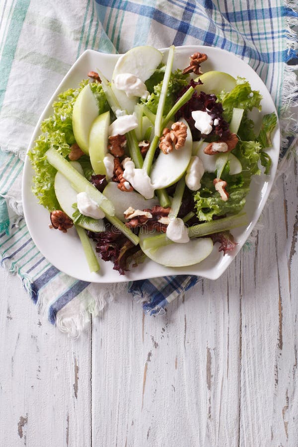 Waldorf Salad with Apples, Celery and Walnuts on a Plate. Vertic Stock