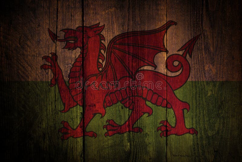 Welsh flag over a grunge wooden background. Welsh flag over a grunge wooden background.