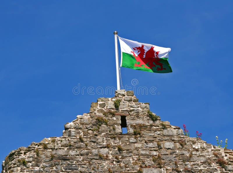 The Welsh flag on top of Mumbles Castle, South Wales UK. The Welsh flag on top of Mumbles Castle, South Wales UK