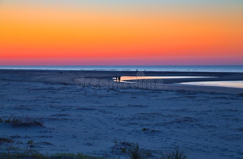 Walkers on Dawn Beach