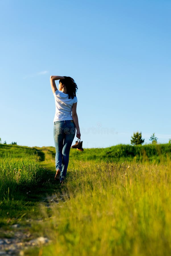 Walking away in summer sunset