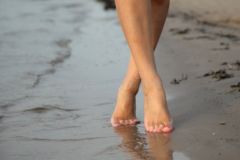 Legs of a Young Woman while Undress Panties. Stock Image - Image