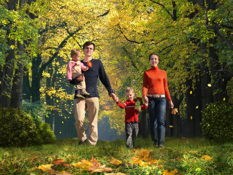 Walking family with children in autumnal park
