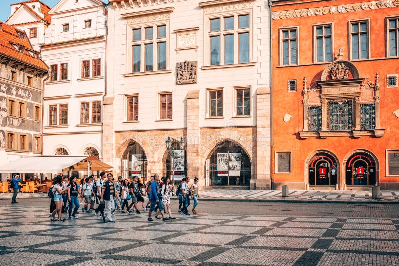 Walking group of tourists in old town Prague.
