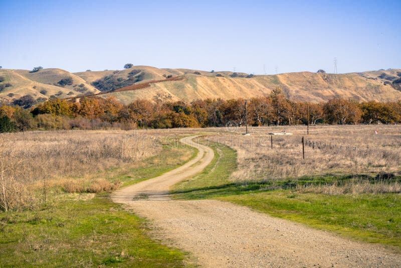 Walking path through grassland, Sycamore Grove Park, Livermore, east San Francisco bay, California royalty free stock photos Walking path through grassland, Sycamore Grove Park, Livermore, east San Francisco bay, California royalty free stock photos