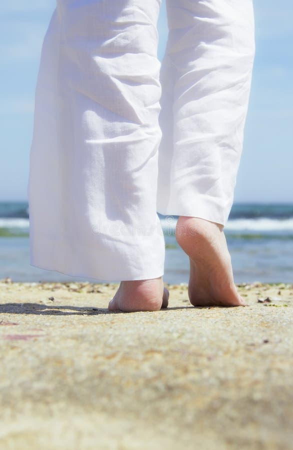 Walking on the sand stock image. Image of caucasian, island 28621425
