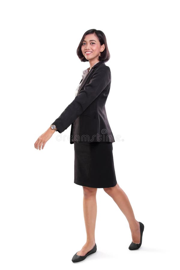 Walking smiling businesswoman, full body