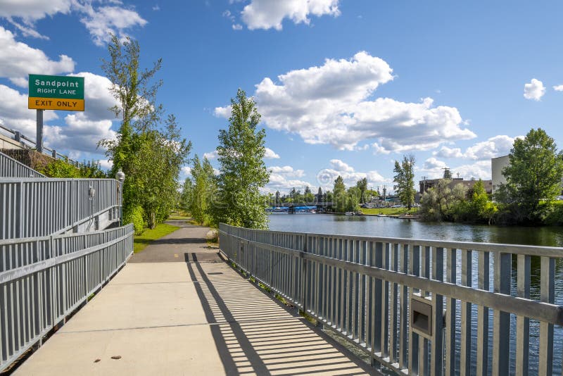 A walking trail path through the public city park near Cedar Street in the mountain town of Sandpoint, Idaho royalty free stock images A walking trail path through the public city park near Cedar Street in the mountain town of Sandpoint, Idaho royalty free stock images