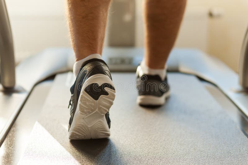 Walking on treadmill. stock photos Walking on treadmill. stock photos