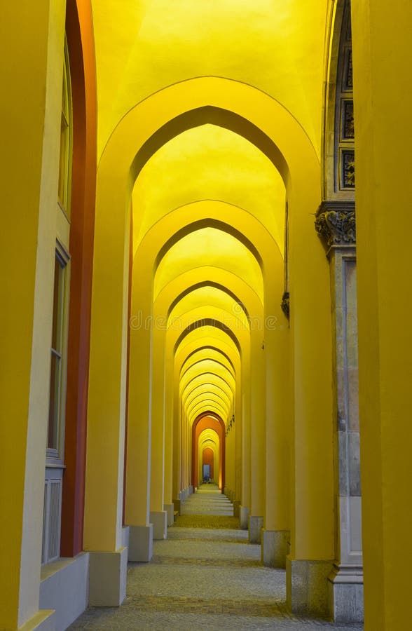 Walkway with arches in Munich. Walkway with yellow arches of Government of Upper Bavaria in Munich, Germany Walkway with arches in Munich. Walkway with yellow arches of Government of Upper Bavaria in Munich, Germany