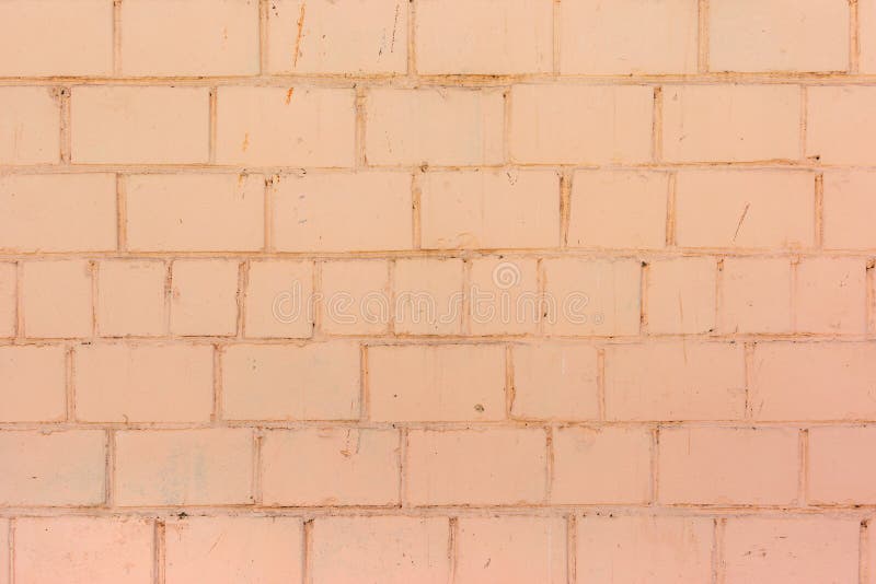 Wall of Bricks Painted in Bright Orange Paint. Texture of Masonry