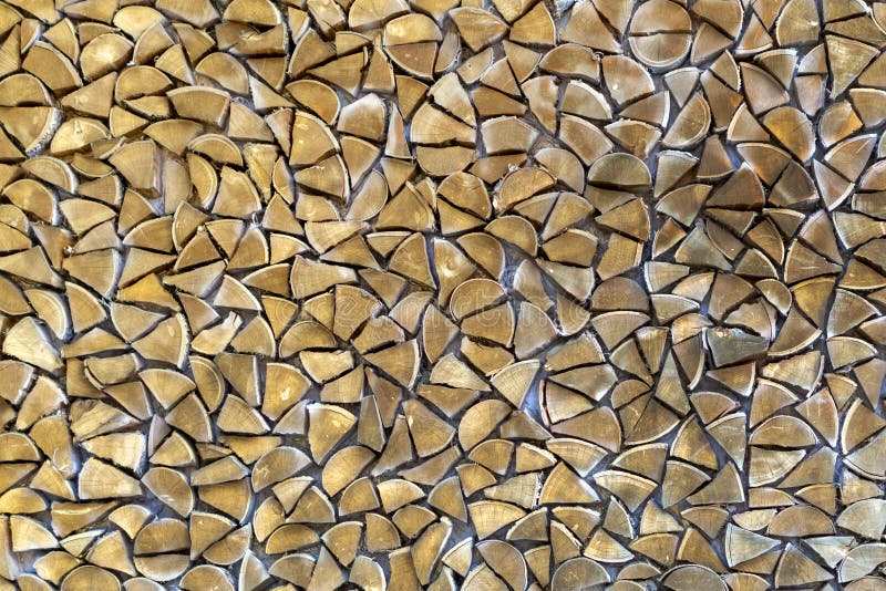 Wall of chopped firewood of a triangular shape. royalty free stock photo