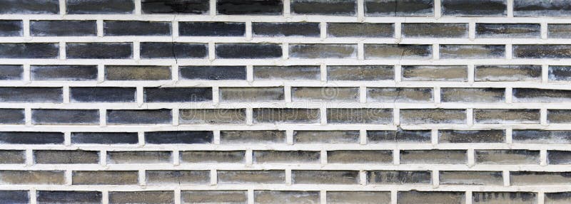 Wall with contrasting masonry, gray and black bricks with light concrete mortar stock photo Wall with contrasting masonry, gray and black bricks with light concrete mortar stock photo