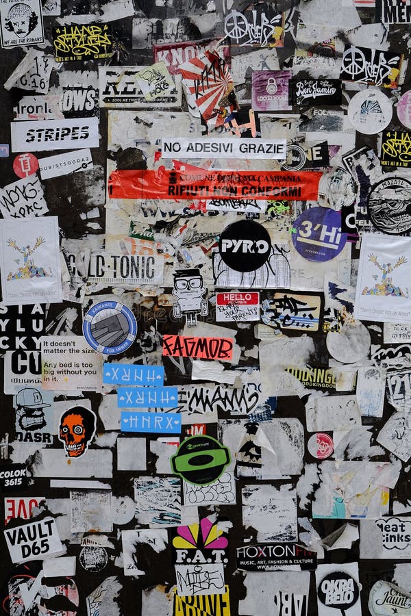 Wall Covered with Adhesive Stickers with Various Messages. Editorial ...