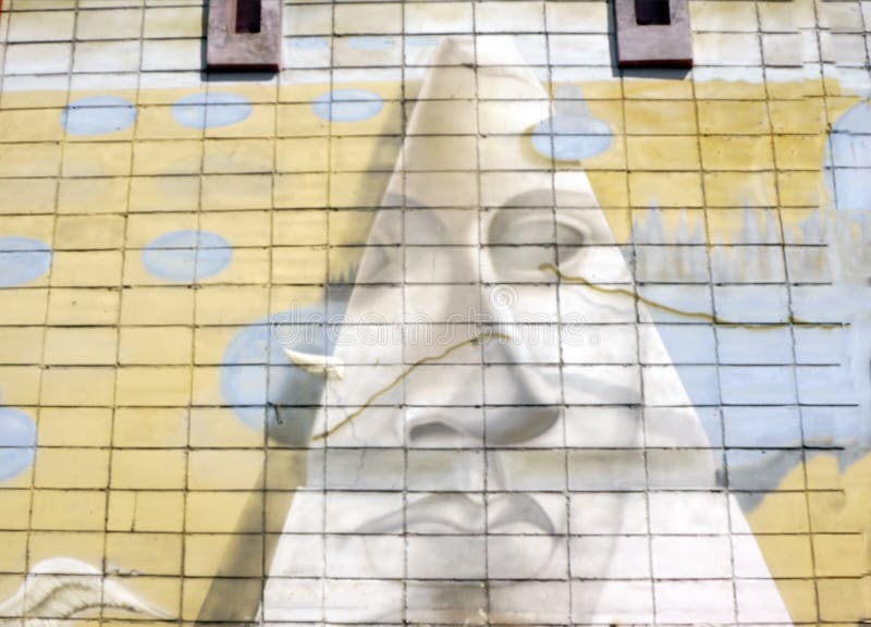 Wall is decorated with abstract drawings house paint closeup. Detail of a graffiti. Fragment for background. Modern iconic urban stock photos