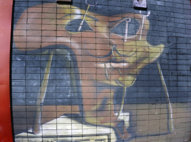 Wall is decorated with abstract drawings house paint closeup. Detail of a graffiti. Fragment for background. Modern iconic urban stock images
