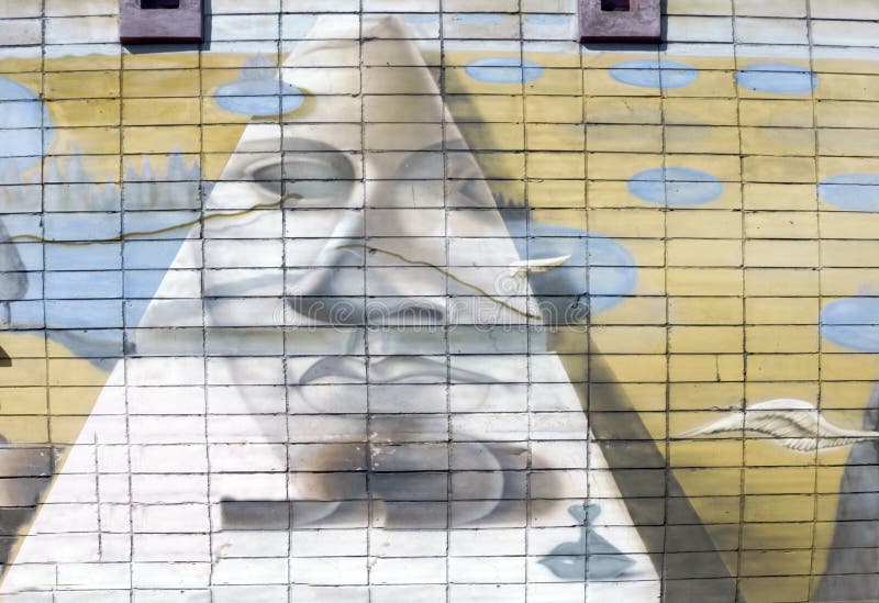 Wall is decorated with abstract drawings house paint closeup. Detail of a graffiti. Fragment for background. Modern iconic urban stock images