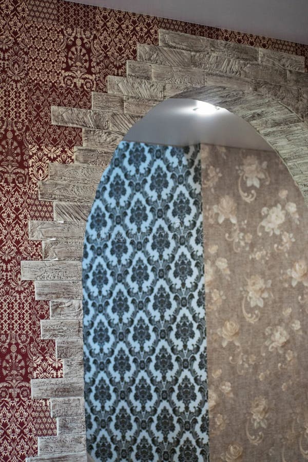 Wall Design. Finishing Works in the House. Decorative Stone on the Wall. Decorating the Arch