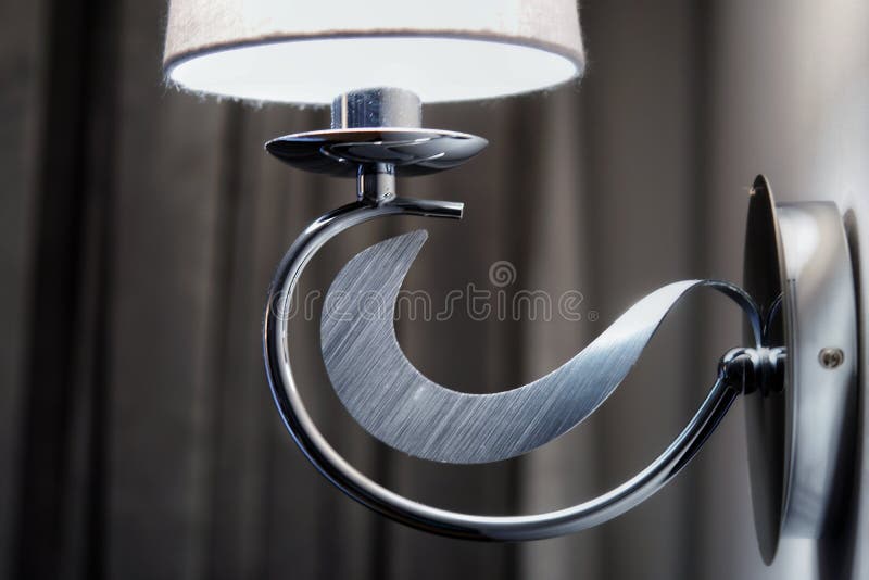 Wall lamp in a hotel room stock image. Image of table 261226457