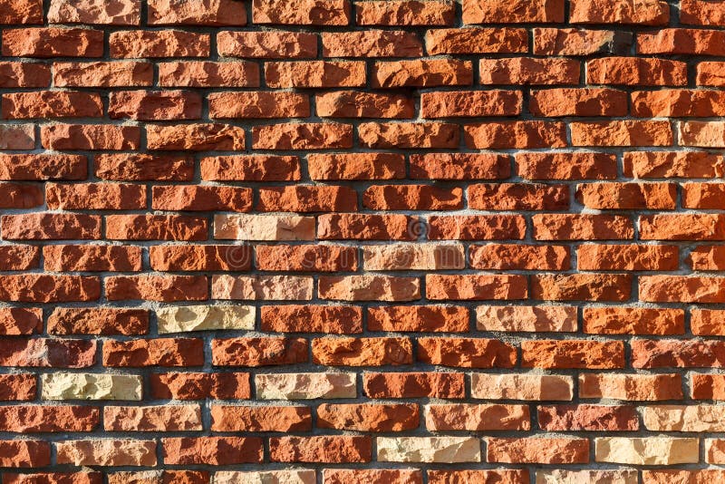 Wall made from chopped red ceramic bricks. royalty free stock photography