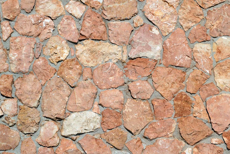 Wall Made of Natural Natural Stone Granite and Sandstone Stock Photo