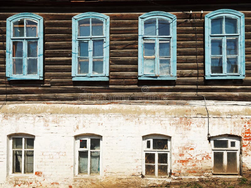 Wall of old russian urban wooden house