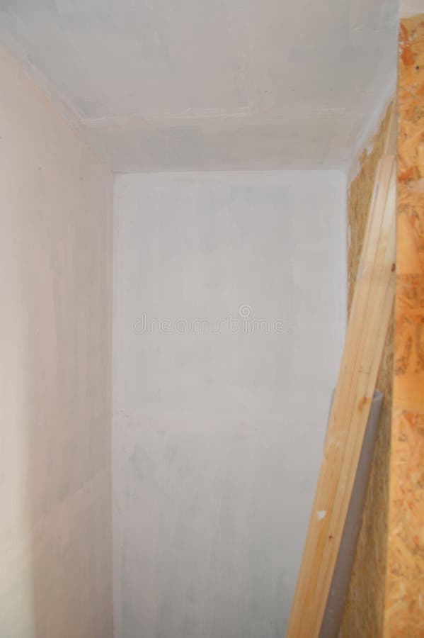 Wall Painting in the Interior with White Waterbased Paint Stock Photo