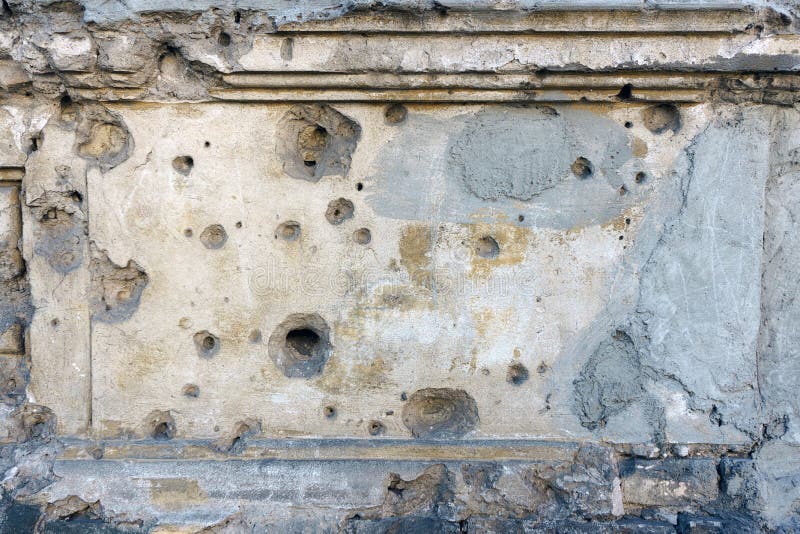 Wall plaster texture with bullet holes
